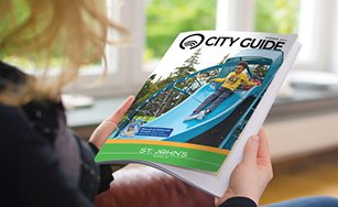 person reading the Summer 2024 City Guide. 