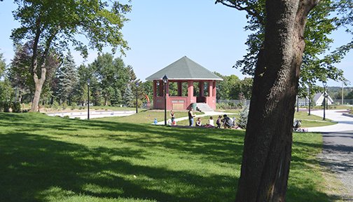 The Bannerman Park Bandstand with people on the grass in the foreground
