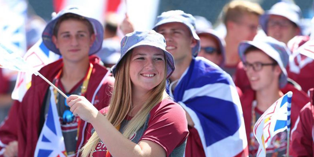 Image of spectators holding Newfoundland and Labrador flags. 