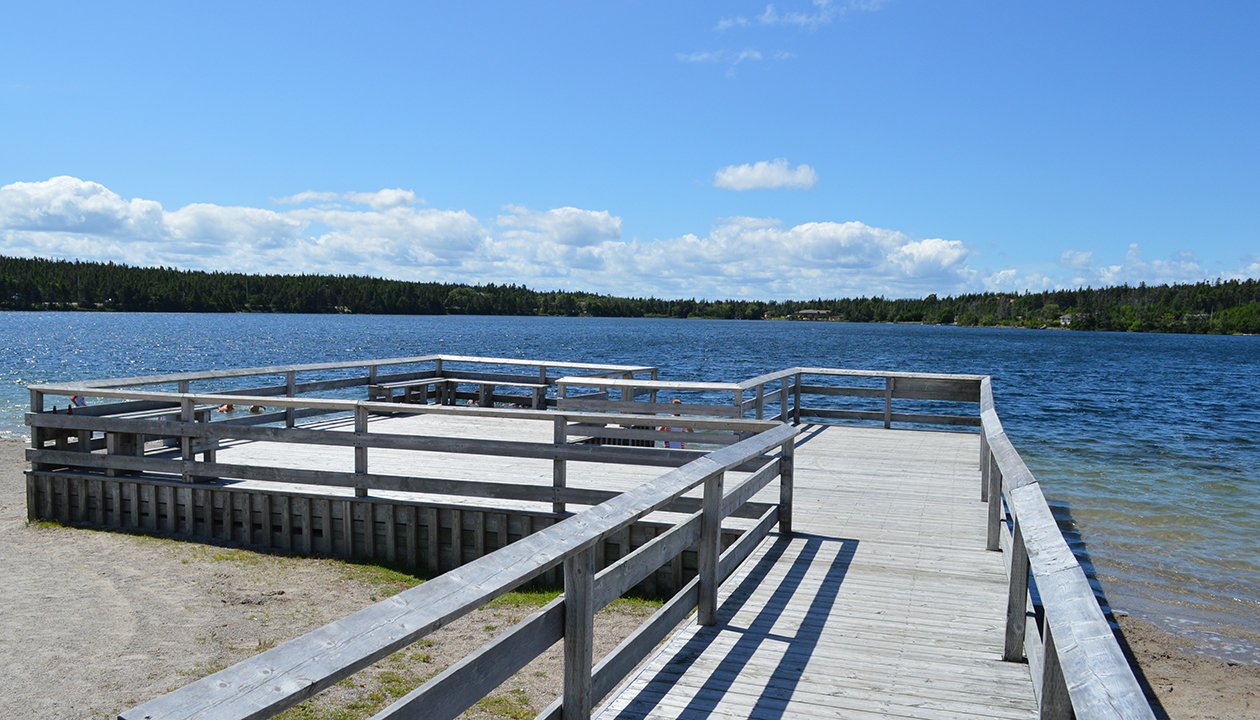 The main wooden dock at Rotary Sunshine Park on Healeys Pond