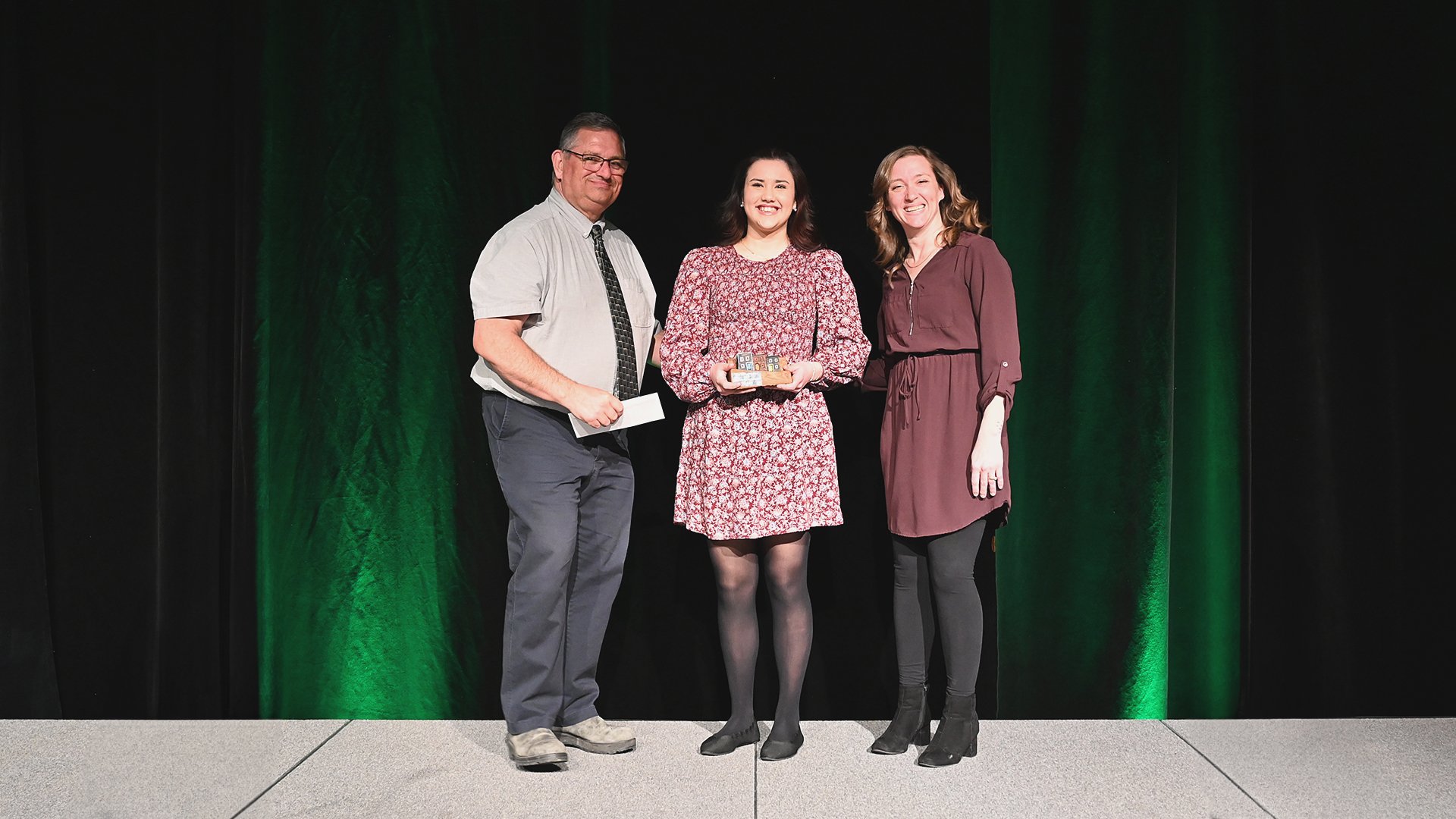 Councillor Ron Ellsworth, left, and Recreation Fieldworker Nicole Murphy, right, present Annabelle Edmunds-Ramsay, with the Junior Youth of the Year Award.