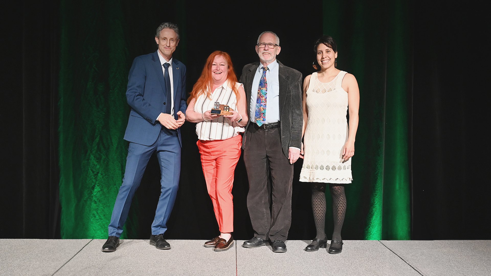 Councillor Tom Davis presents a group from the Food Producers Forum Inc. with the Community Climate Change Leadership Award.