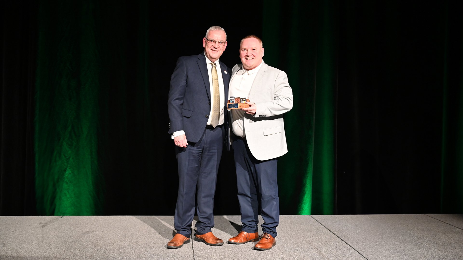 St. John's Mayor Danny Breen, left, presents Galway Hitmen coach Mark Dwyer the Team of the Year Award
