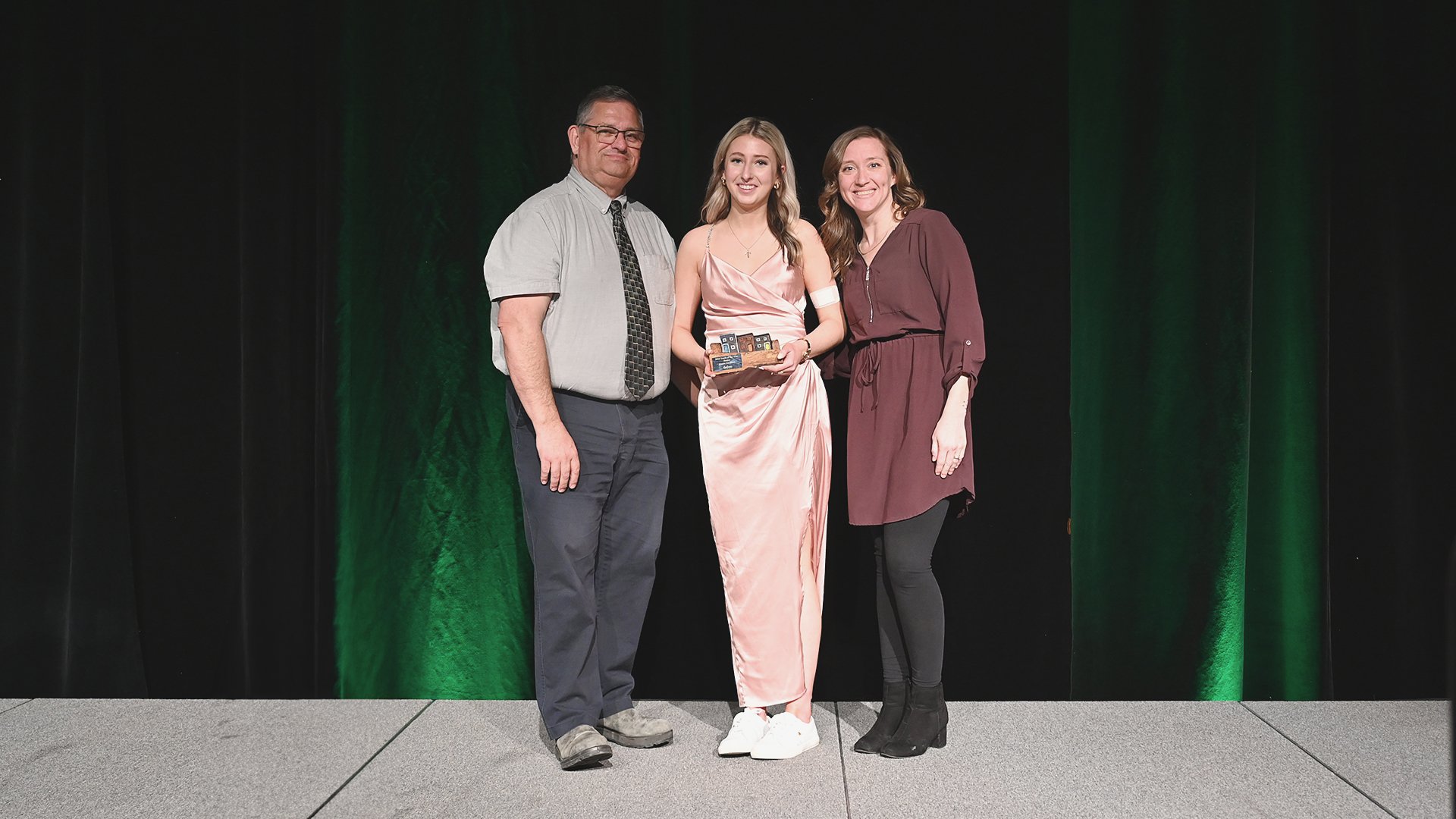 Councillor Ron Ellsworth, left, and Recreation Fieldworker Nicole Murphy, right, present Klaire Gardiner with the Senior Youth of the Year Award.