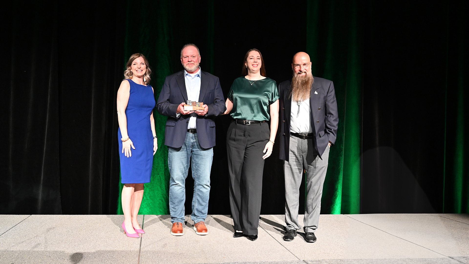 Ward 1 Councillor, Jill Bruce, left, presents representatives from St. John's Walking Tours with the Tourism Excellence Award.