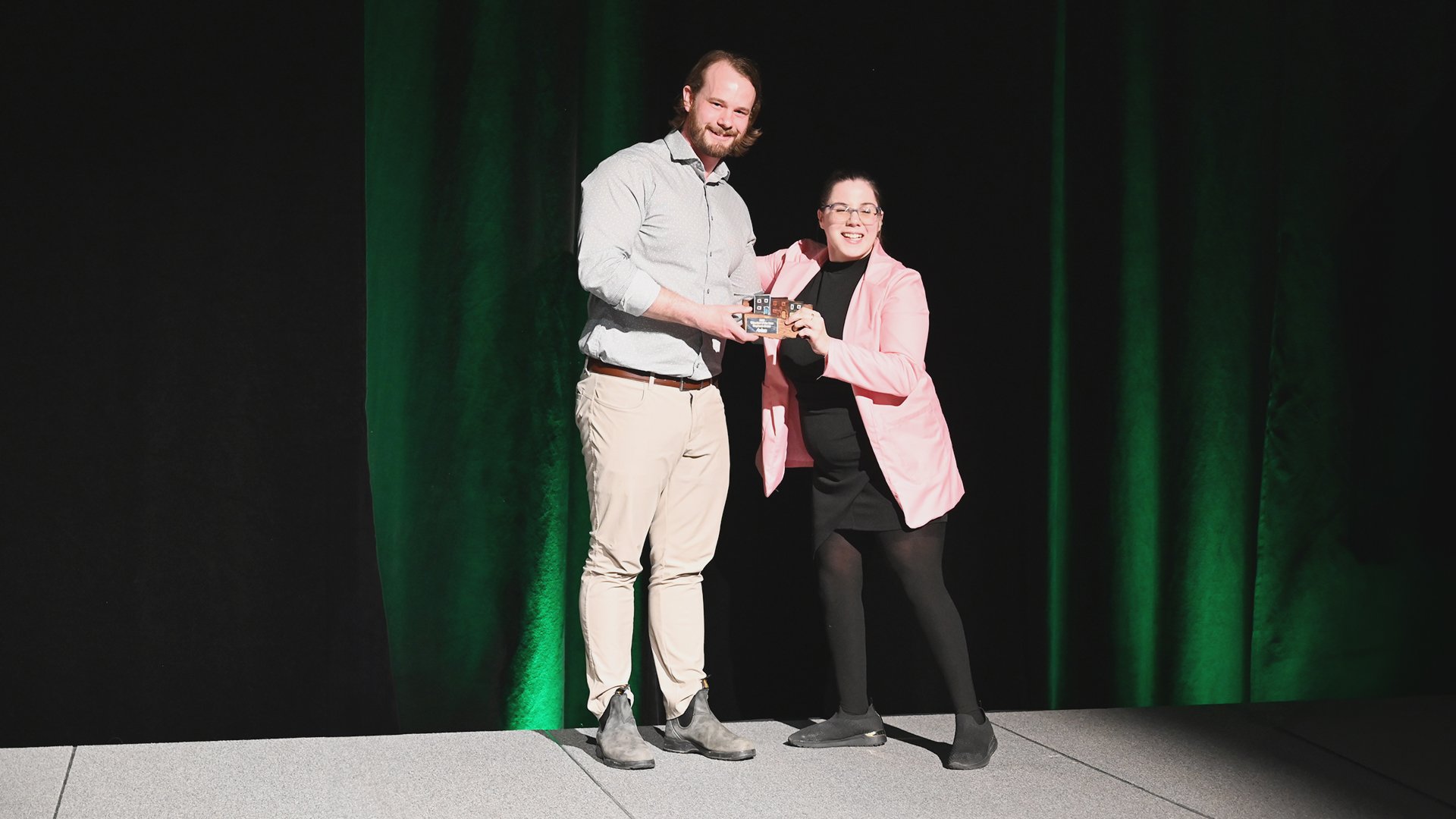 Councillor Greg Noseworthy presents Stephanie Evans with the Individual Volunteer of the Year Award.