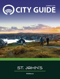 View of downtown ST. John's from Signal Hill with two people walking in foreground