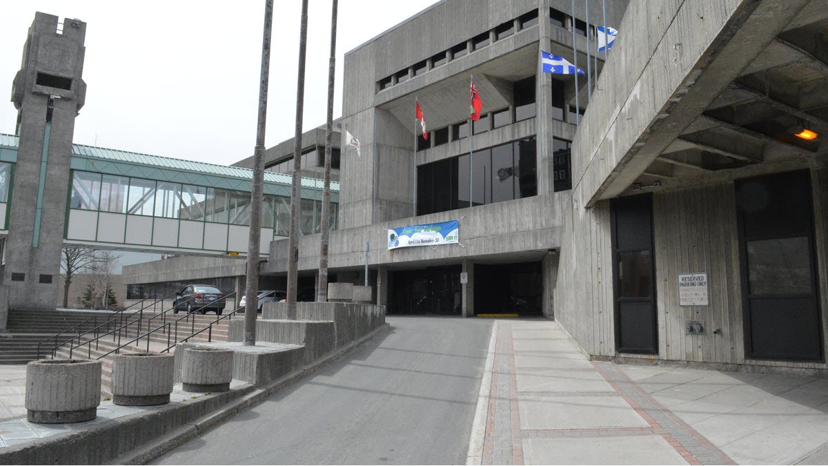 exterior of City Hall Annex with pedestrian overpass visible