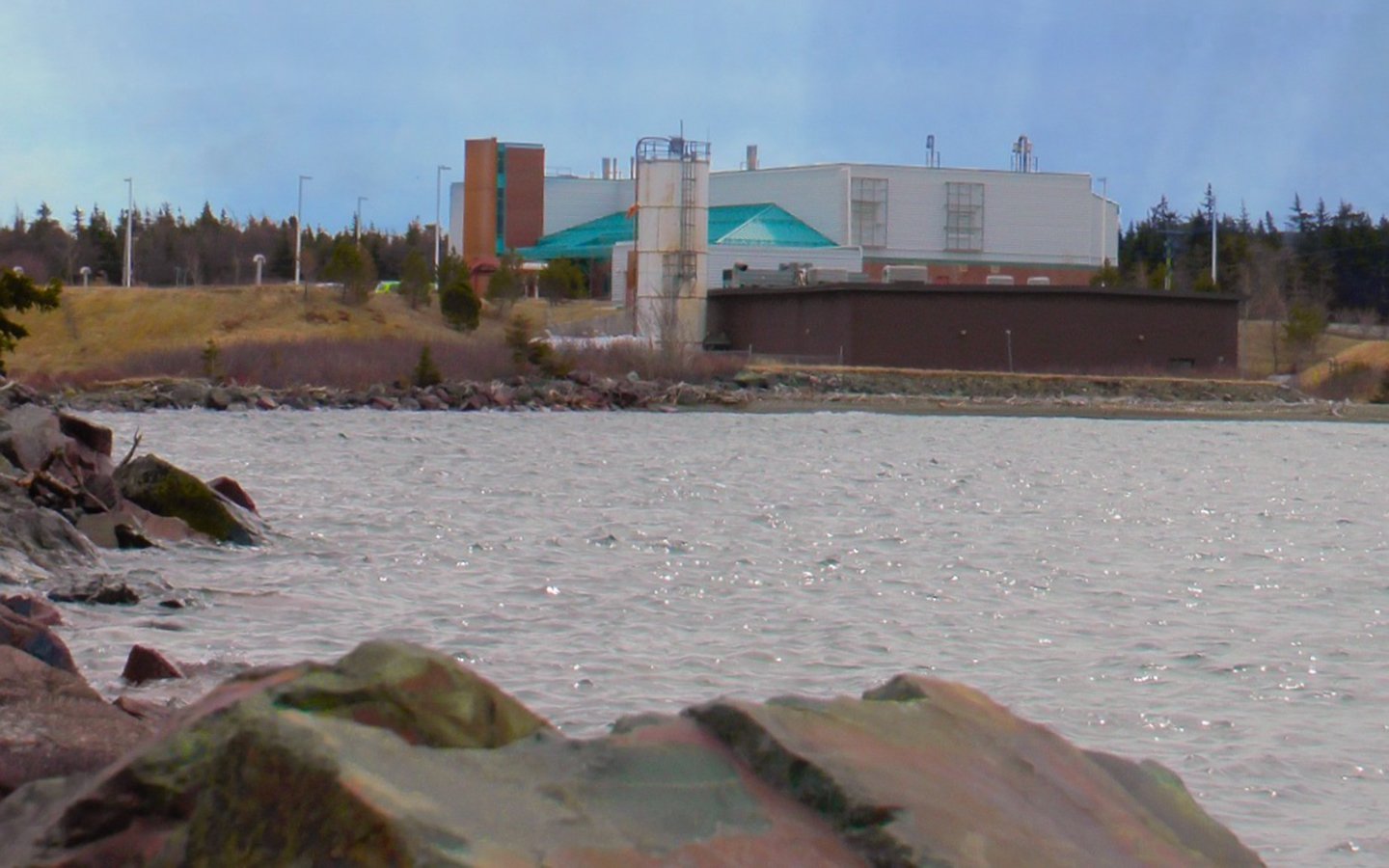 Windsor Lake in the foreground and the Windsor Lake Water Treatment facility in the background on the far shore