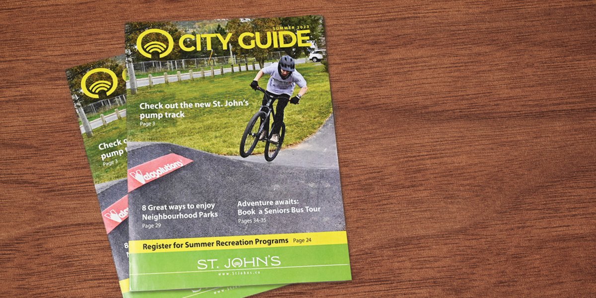 front cover of the 2023 Summer City Guide with a mountain biker at the pump track. 