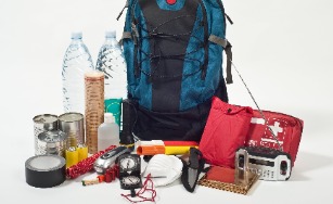 backpack with items in a kit including bottles of water, flashlight, radio, etc.