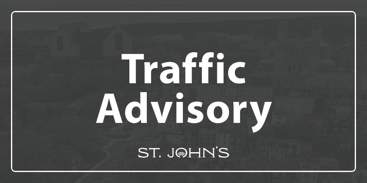 grey background with white text that says Traffic Advisory.