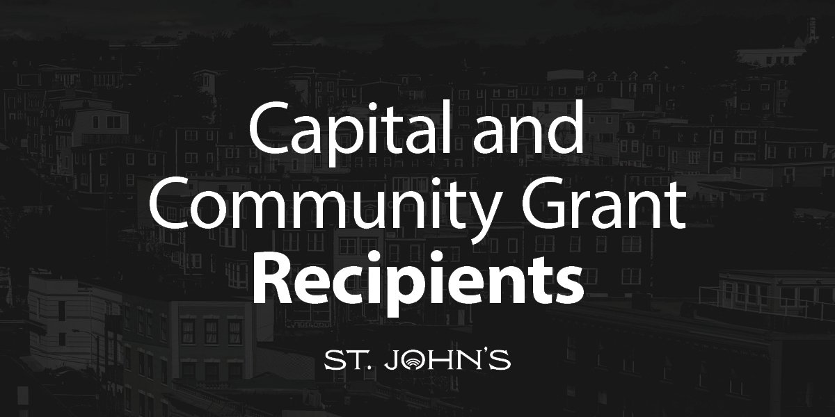 a city scape with a dark grey overlay with the text "Community and Capital Grants"