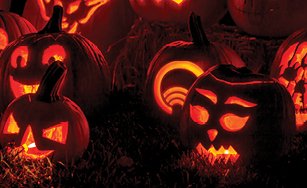 Image of several lit jack-o'-lanterns