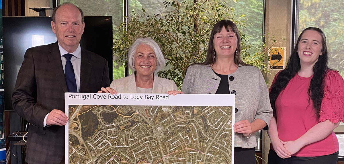 MHA John Abbott, MP Joanne Thompson, Deputy Mayor Sheilagh O'Leary and Councillor Chelsea Lane stand holding map of shared use path in front of them