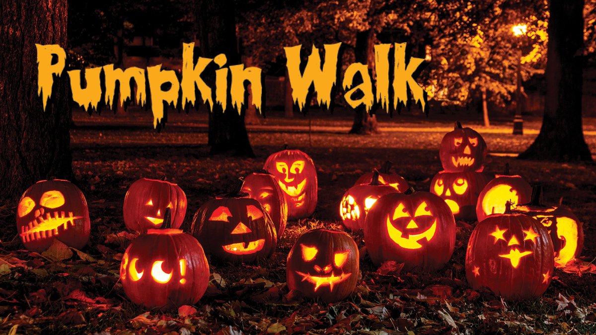 Multiple pumpkins are illuminated in a park at night. Text: Pumpkin Walk.