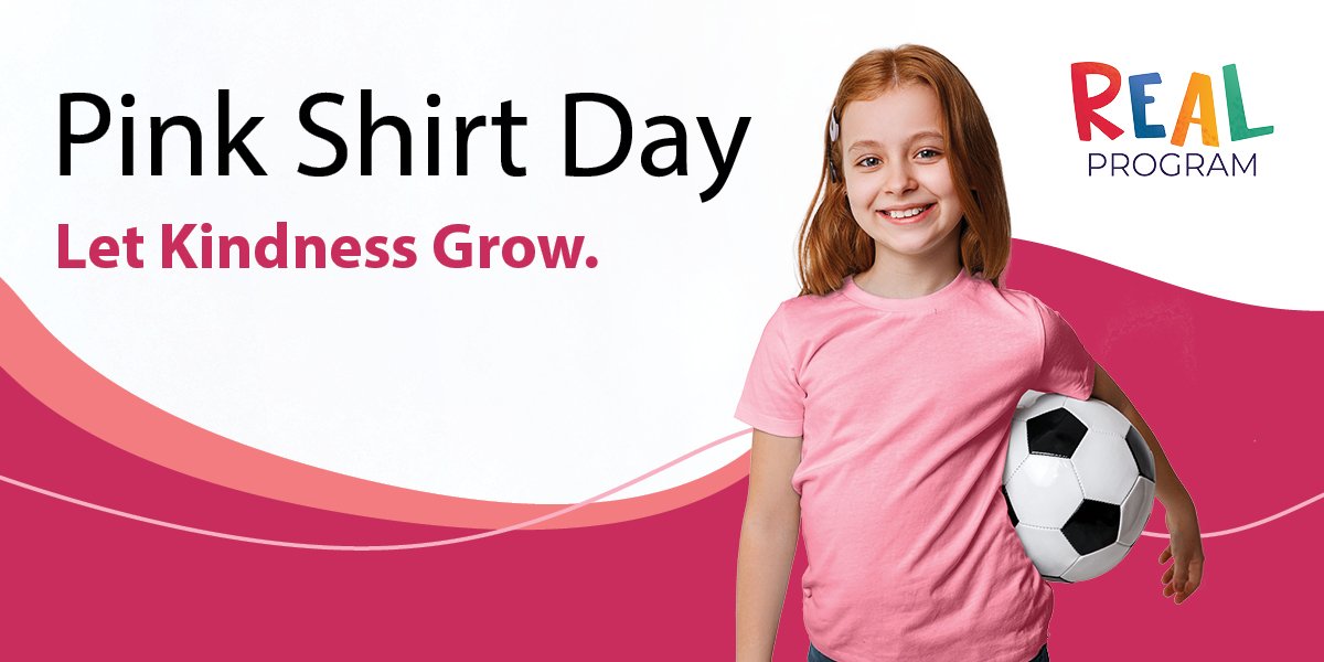 Youth standing back on with their arms around each other wearing pink shirts, includes REAL Program logo. 