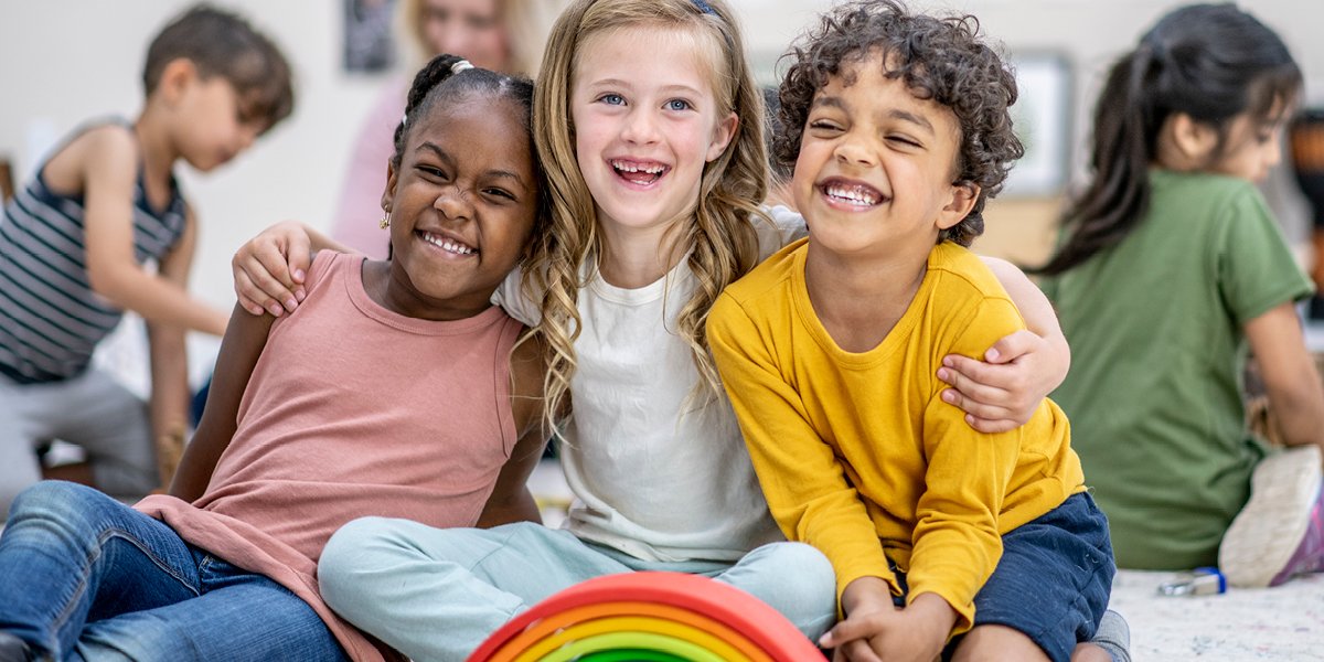 children smiling and hugging