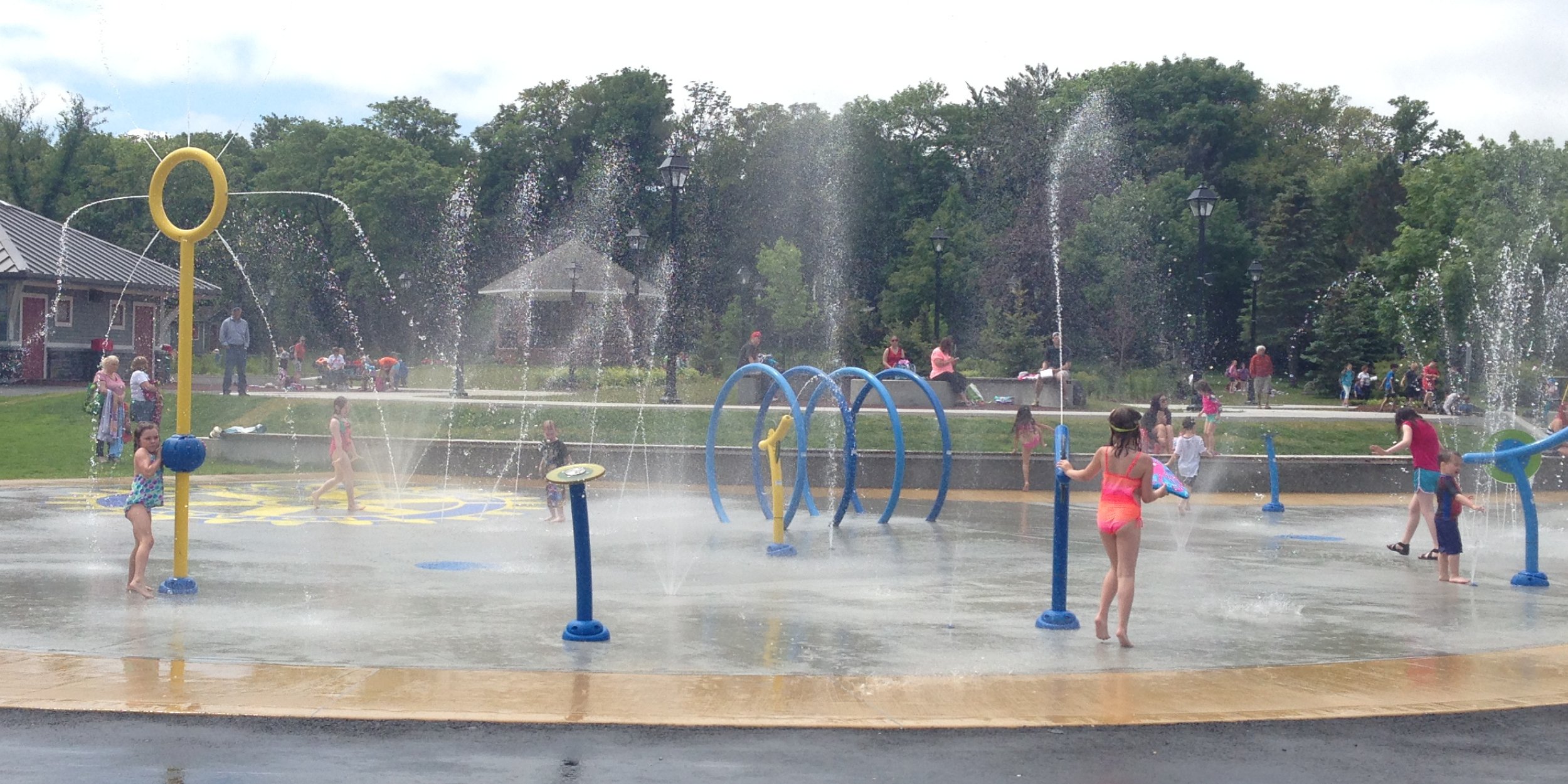 Children playing at the splash pad in Bannerman Park. 
