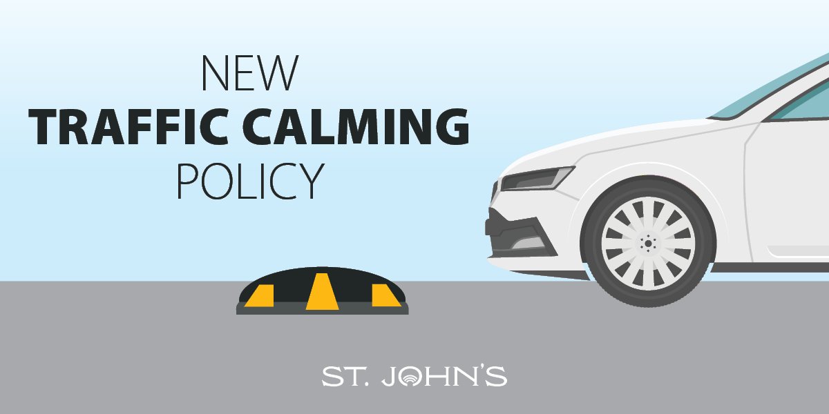 A white car is approaching a speed bump, and a sign reads 'Traffic Calming'