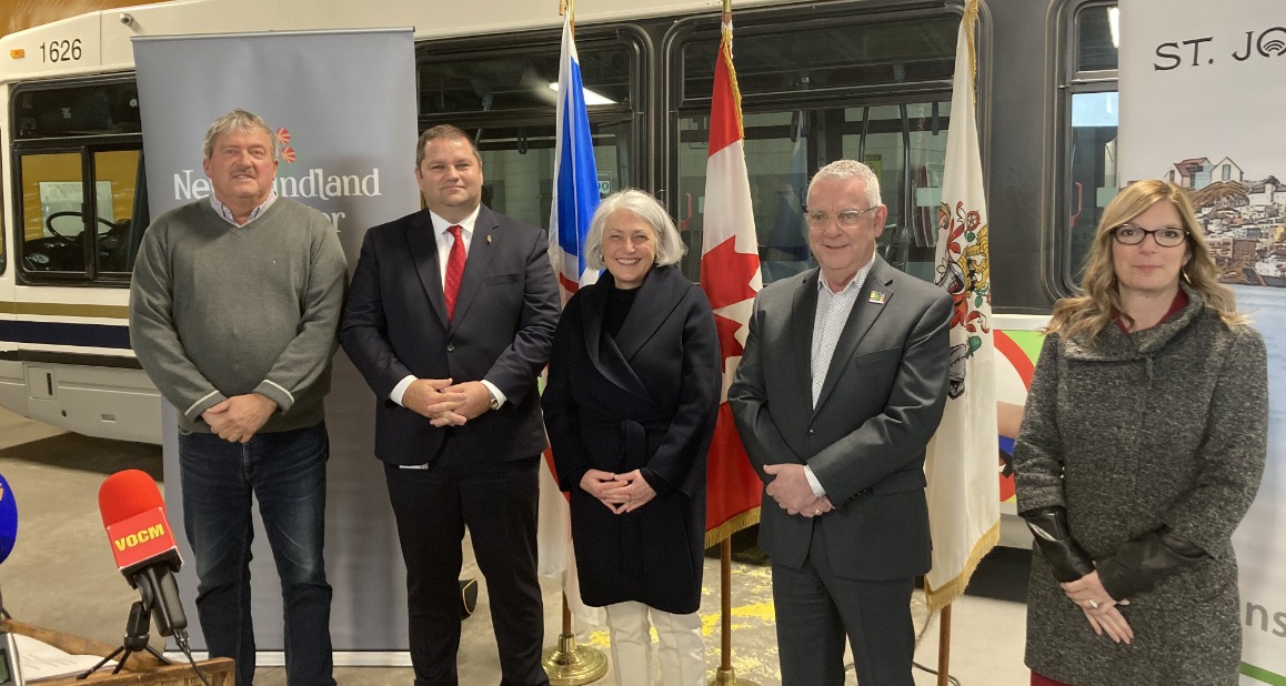 Councillor Sandy Hickman, MHA Bernard Davis, MP Joanne Thompson, Mayor Danny Breen and Councillor Jill Bruce stand in front of a Metrobus