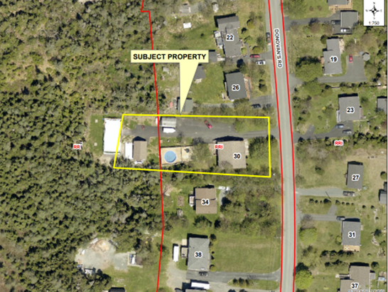 aerial photo showing subject property highlighted in yellow box