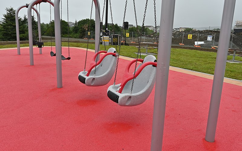 Photo of plastic accessible swings part of playground equipment set