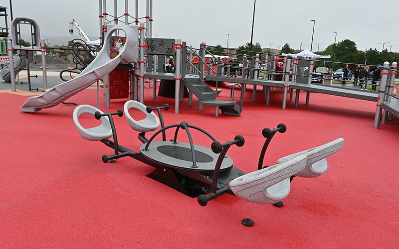 Photo of accessible teeter todder playground equipment that can accommodate four people