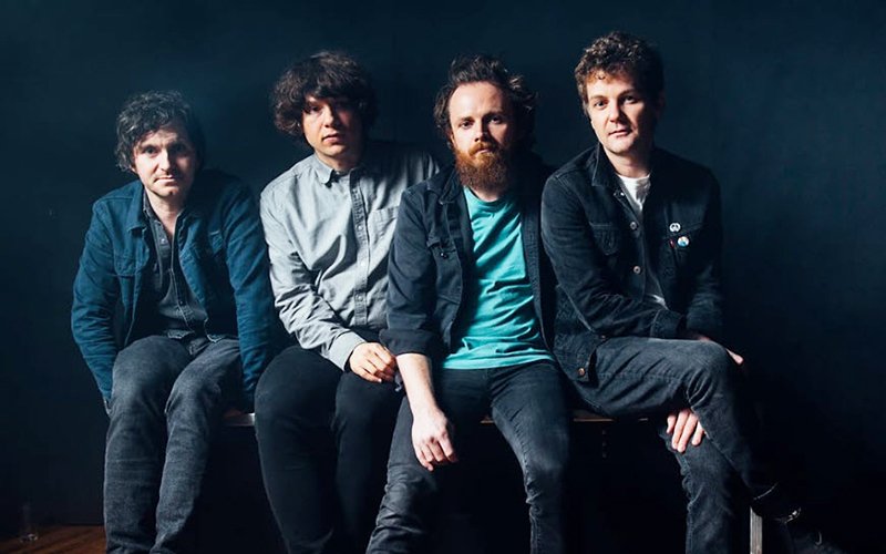 Group photo of the four members of the Novaks
