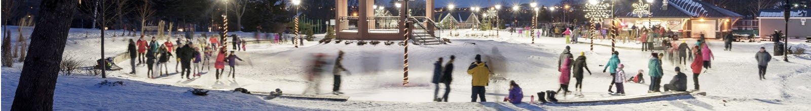 people skating at night at the Loop around the bandstand