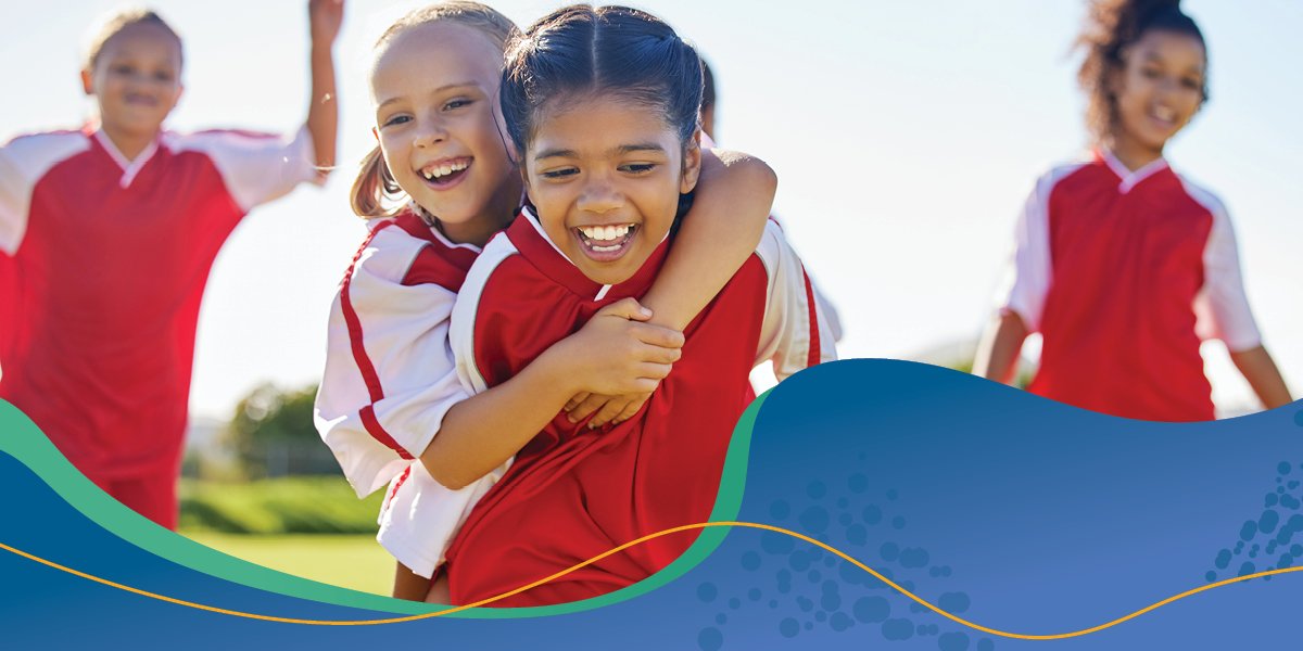 children's sports team smiling and laughing. 