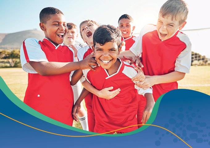 a children's sports team smiling and laughing. 