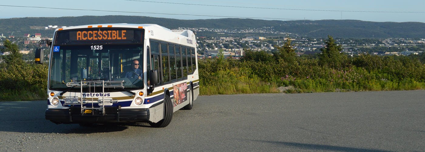 wide shot of Metrobus turning in parking lot 