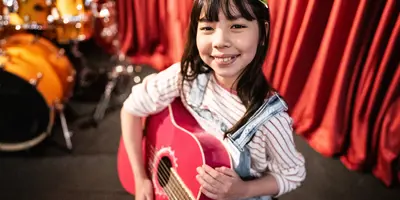a child playing guitar 