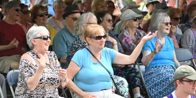 people at Party in the Park laughing