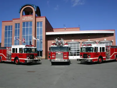 outside of Central Fire Station with three trucks out front