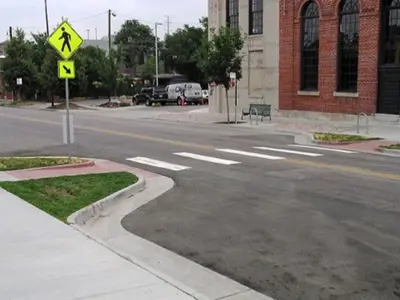 shows the extension of a curb on a local roadway 