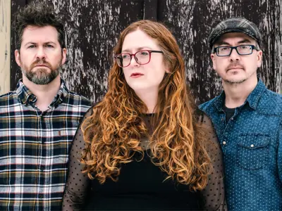 Image of three members of the band Cove Pond