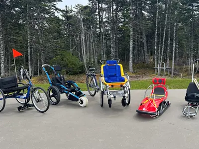 various types of adaptive equipment in a park setting