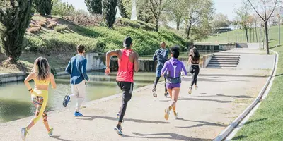 Image of several people running or jogging outside