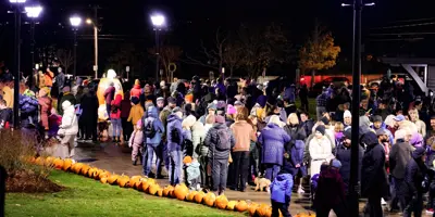 people gathering at Pumpkin Walk
