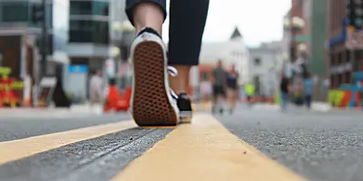 ground level photo of someone walking on the Downtown Pedestrian Mall