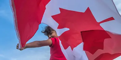 a person holding a Canadian Flag 