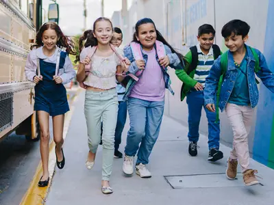 kids near a school bus