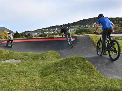 kids riding on the pump track