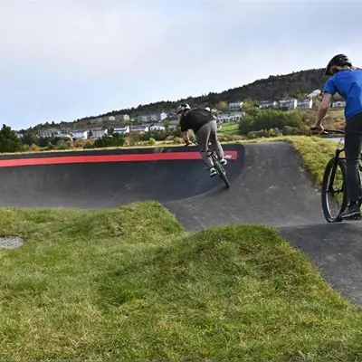kids riding on the pump track