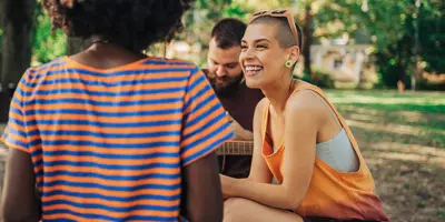 people laughing in a park setting